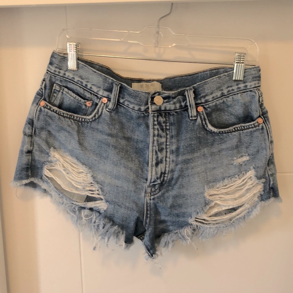 Free People buttonfly cutoff denim shorts.